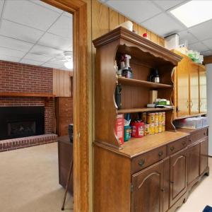 View into the Office / Sitting Room, A second fireplace with gas logs warms the office, perfect to chase off the chill when you come inside from the porch.