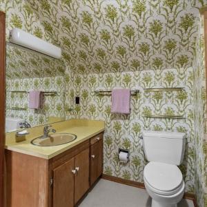 Full Bathroom on Second Floor, This is an ensuite to a second primary bedroom, and also has hall access serving the upstairs.