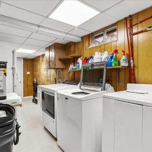 Laundry and Storage - Basement, The laundry room has an exterior entrance and is also accessible from the basement suites.
