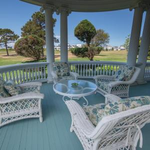 Back porch overlooking bay and golf course