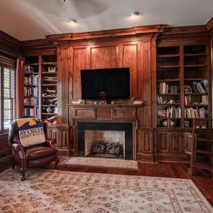Study with rich walnut stained pine paneling