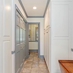 Hallway from kitchen leading to 1st floor half bat