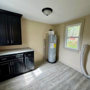 laundry room with cabinet and folding counter