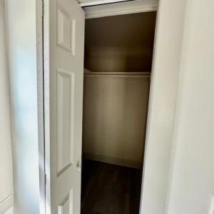 Downstairs multipurpose room with walk-in closet
