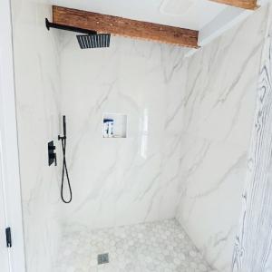 Exquisite marble and tile shower Upstairs.