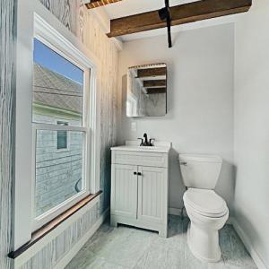 Upstairs Bathroom.  Fixtures opposite the spacious