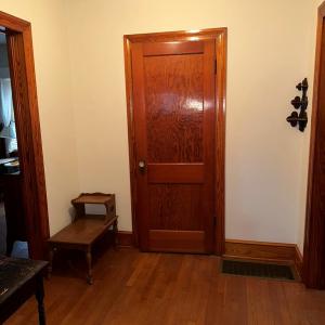 Hallway to bedrooms, bath, and attic stairs
