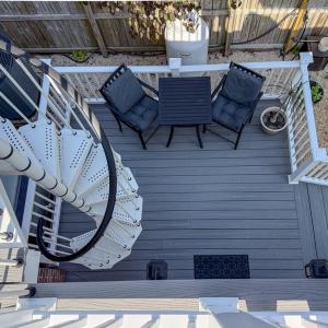 back deck leading up to balcony off of Primary ens