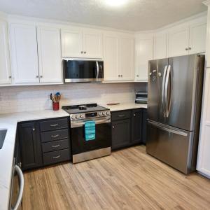White Subway Tile Backsplash & Pantry Cabinet