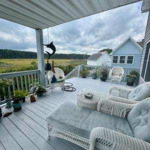 Open decks on both sides of covered porch.