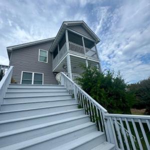 Staircase to ground level deck.