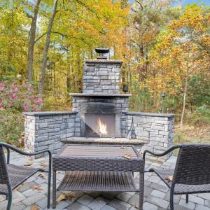 Stone Patio with Fireplace for chilly evenings.