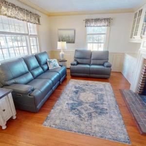 Formal living room with wood burning fireplace.