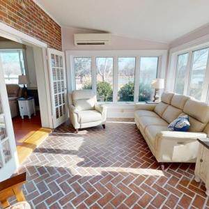 Spacious sunroom overlooking Finney Creek.