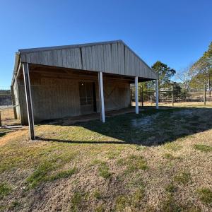 Barn with covered loafing area.