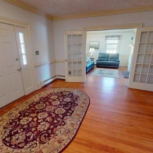 Welcoming foyer looking into formal living room.