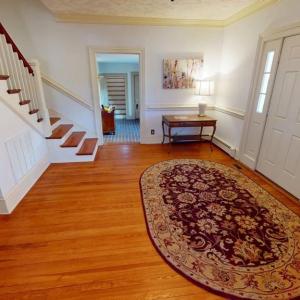Foyer looking toward primary suite wing.