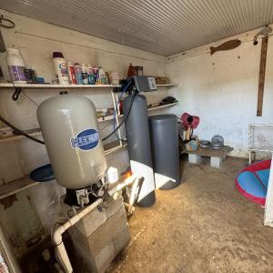 Icehouse interior and well pump equipment