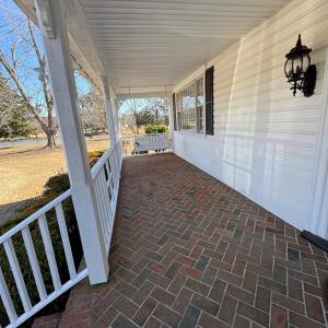 Come on in or linger awhile on the porch swing.