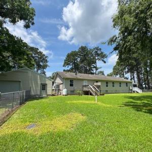 portion of rear yard is fenced for fido or kiddo