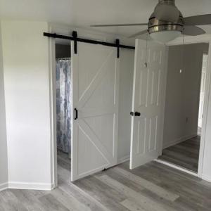 Interior barn doors on owner's bathroom