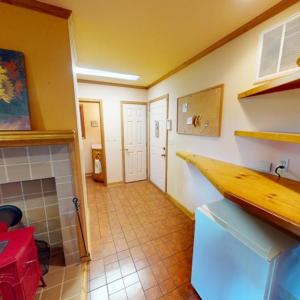 From kitchen towards 1/2 bath, garage & laundry