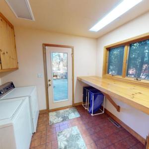 laundry/mud room with access to rear deck