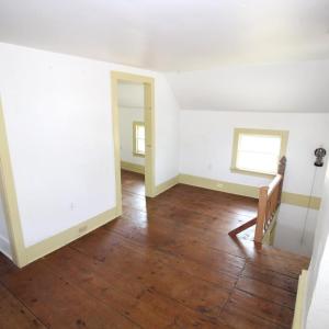 Front bedroom with stairway to kitchen