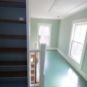 Upstairs hallway is bright and open