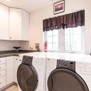 upstairs utility room with sink