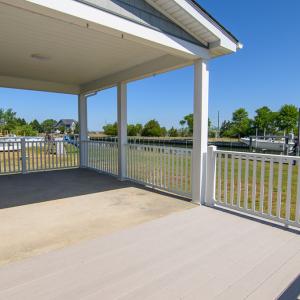 Covered porch and deck overlooking water