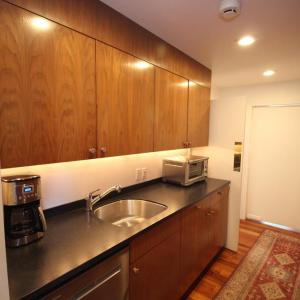 Butlers pantry, Opposite the sink in a solid wall of cabinets.