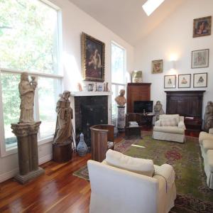 Living room, There is a wonderful creek view through the window to the left of the wood burning fireplace.