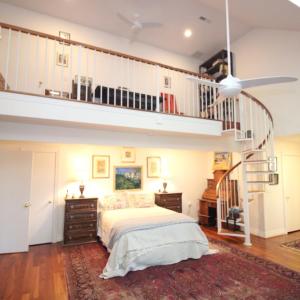 Primary suite, The master bath is to the right and it has a breathtaking creek view.