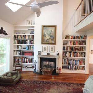 Primary suite. The study is on the the side of the wall from the fireplace and shares the "two sided fireplace" A most unusual feature.