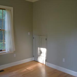 Downstairs bedroom with pantry door