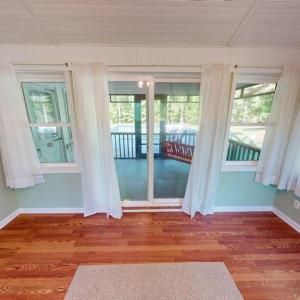 Sunroom leading to screen porch