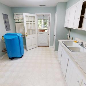 Laundry room leading out to screen porch