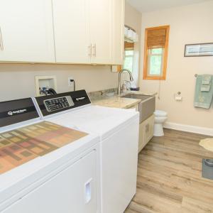 Utility/Laundry, Large Capacity Washer & Dryer, Utility/Farm Sink, Lots of Custom Storage and Shower
