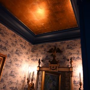 Powder room metallic copper ceiling