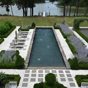 Gunite pool surrounded by gardens
