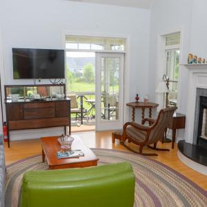 Living Room, Vaulted Ceilings, Fireplace and French Doors out the porch