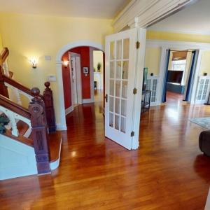 Check out this foyer and the woodwork  on the stai, Many architectural details throughout.