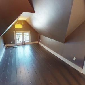 Third floor bonus room , With attic space on both ends behind those doors.