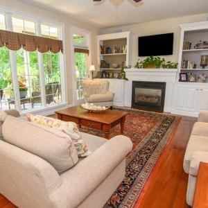 Family Room , Added Features include built in bookcases, gas fireplace, entrance to porch