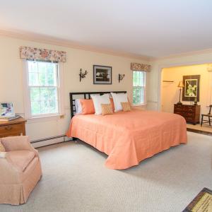 1st Floor Primary, Features include private bath, WIC, crown molding and hardwood floors.