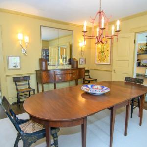 Formal Dining Room, Features include crown molding, sconces, and hardwood floors.