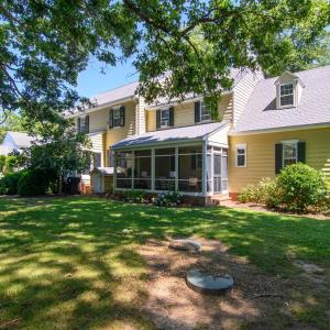 Back, Spacious yard with lovely landscaping.