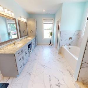Double vanity and extra long soaking tub.