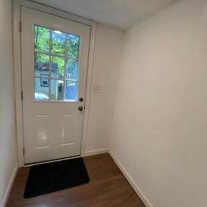 Back door from parking area and shed access area that keeps mud and dirt in the laundry room area
